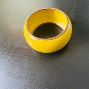 Yellow bangle.